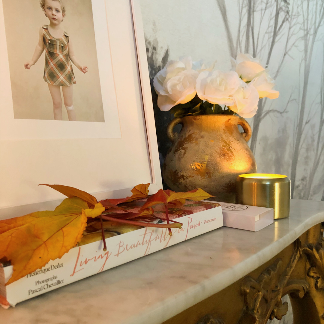 Hello Lovely's entry in Fall with colorful leaves on a French console with candles. #modernfrench #hellolovely #fallentry