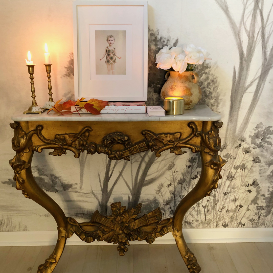 Hello Lovely's entry in Fall with colorful leaves on a French console with candles. #modernfrench #hellolovely #fallentry